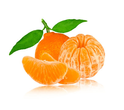 Tangerine with leaves and slices isolated on white
