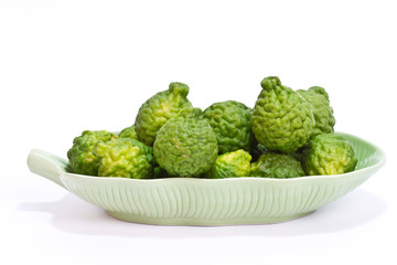 Kaffir Lime in the dish on white background.