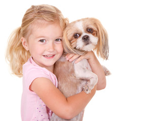 young  girl holding pet dog