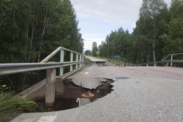 Broken asphalt on bridge caused by heavy rain, Sweden