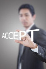 Businessman holding Accept word on the whiteboard.