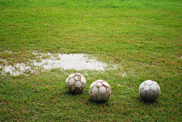 Footballs on a Wet Field