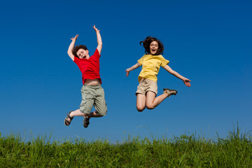 Girl and boy running, jumping outdoor