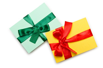 Envelope with colourful ribbon on white