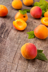 Fresh apricots on wooden table