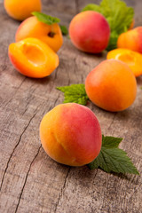 Fresh apricots on wooden table