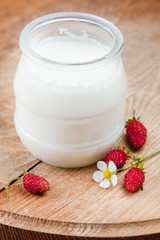 Natural yoghurt in a glass pot