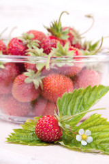 Fresh strawberry, flower and leaves