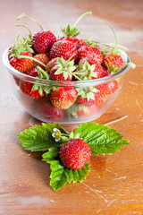 Glass bowl with strawberries