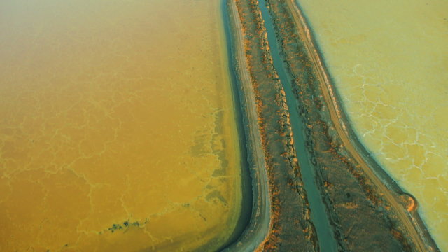 Aerial view of mineral deposits in salt ponds