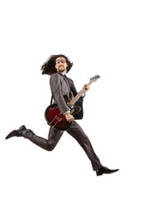 Obraz premium Guitar player in business suit on white