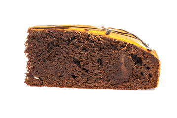 Piece of chocolate cake with icing on white isolated background