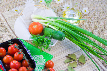 ripe red tomatoes and fresh greenery