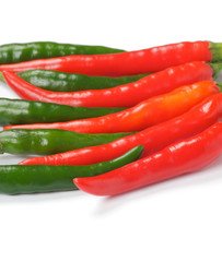 Arrangement of green and red chili peppers