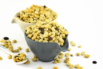 fresh coffee grains in cup  before roasted.