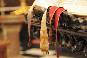 Old latin book in church with bookmarks