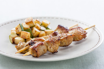 pork skewer with fried zucchini