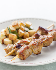 pork skewer with fried zucchini