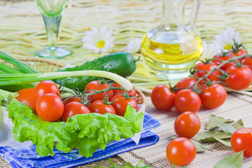 ripe red tomatoes and fresh greenery