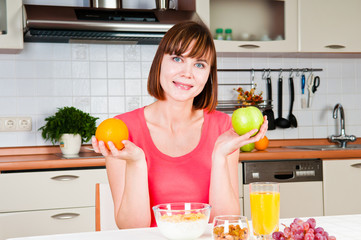 beautiful woman holding a apple and orange