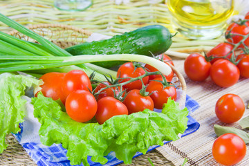 ripe red tomatoes and fresh greenery