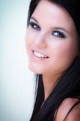 Fototapeta premium Closeup of a cheerful young woman smiling