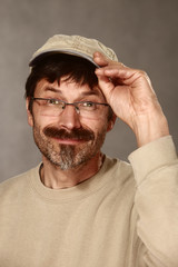 man with baseball cap greeting friendly