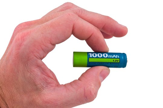 people hand holding electric battery