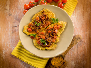 escalope with curry onions and tomatoes