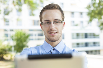 Businessman With Tablet Computer in park