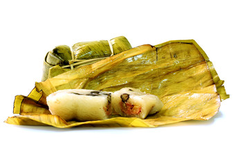 steamed sticky rice with bean and banana in banana leaf