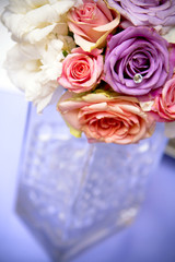 Elegant holiday flower centerpiece, glass vase.