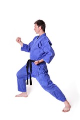 Karate man posing on a white background