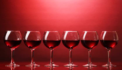 Wineglasses on red background