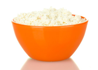 cottage cheese in orange bowl isolated on white