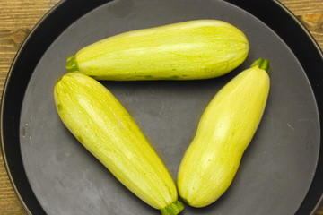 squash in a pan on a wooden table close-up