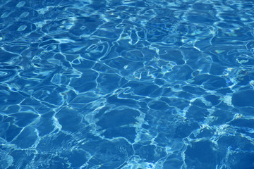 Hotel swimming pool with sunny reflections