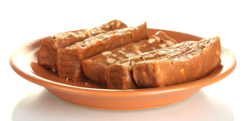 Cut east sweets - sherbet with nuts in the plate isolated