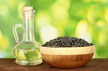sunflower oil in small decanter with sunflower seeds