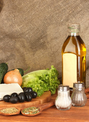 Ingredients for a Greek salad on canvas background close-up