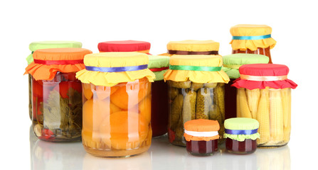 Jars with canned fruits and vegetables isolated on white