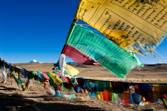 Tibet prayer flags with sacred mountain in the background