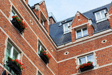 beautiful house with the balconies decorated with flowers