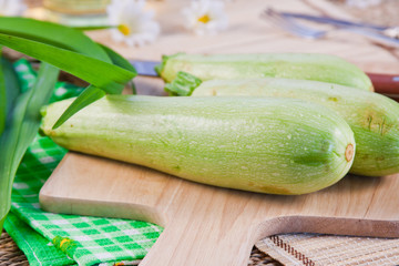 vegetable marrows on a wooden board