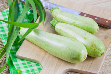 vegetable marrows on a wooden board