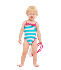 Baby girl in swimsuit holding handbag