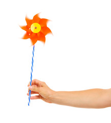 Closeup on hand holding pinwheel