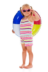 little girl with sunglasses and inflatable ring