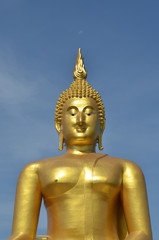 Fototapeta na wymiar Golden Buddha statue at Wat Muang in Angthong, Thailand