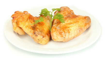 roasted chicken wings with parsley in the plate isolated